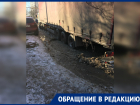 КАМАЗы застревают в ямах на частично отремонтированной улице в Ростове